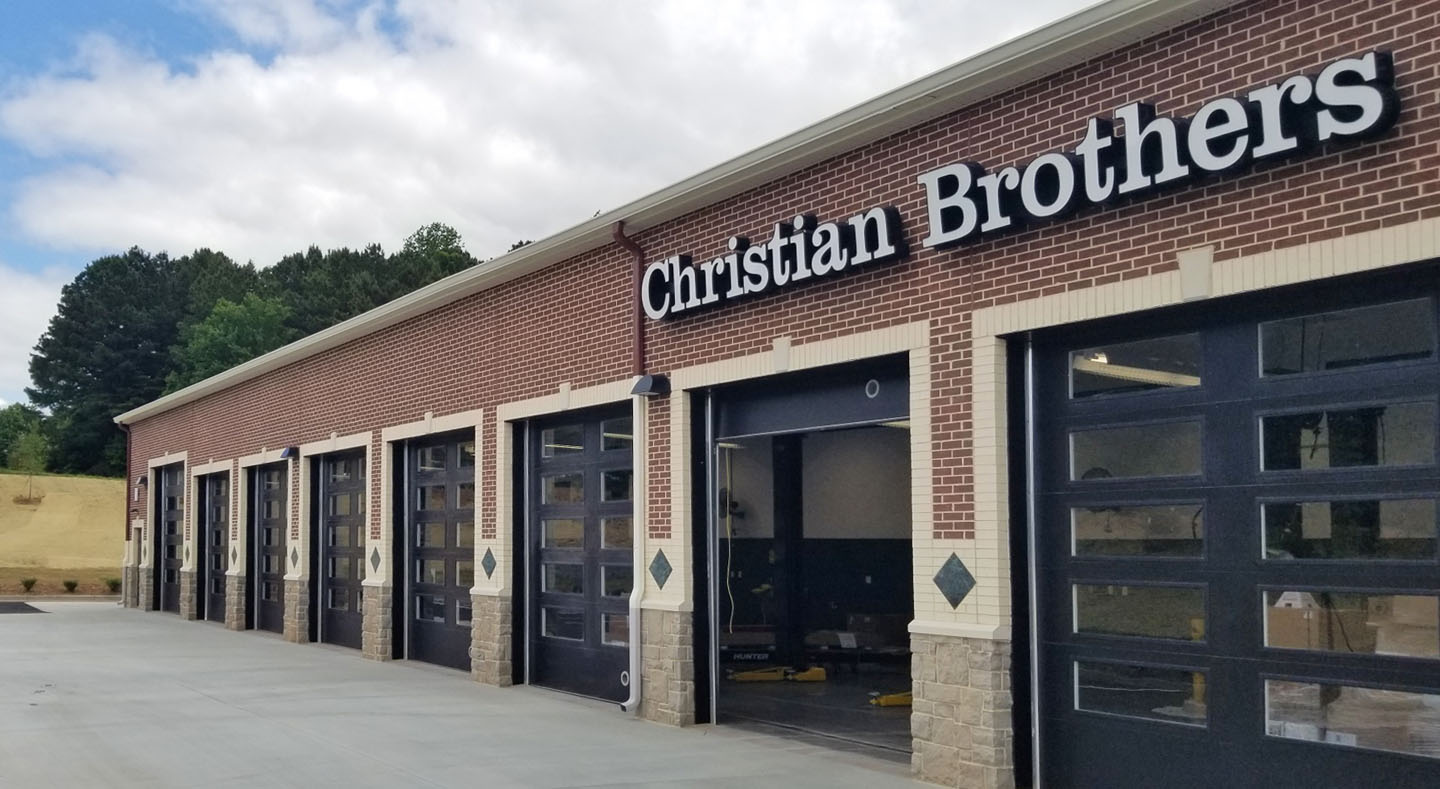 Exterior of a Christian Brothers automotive repair shop with multiple service bays.