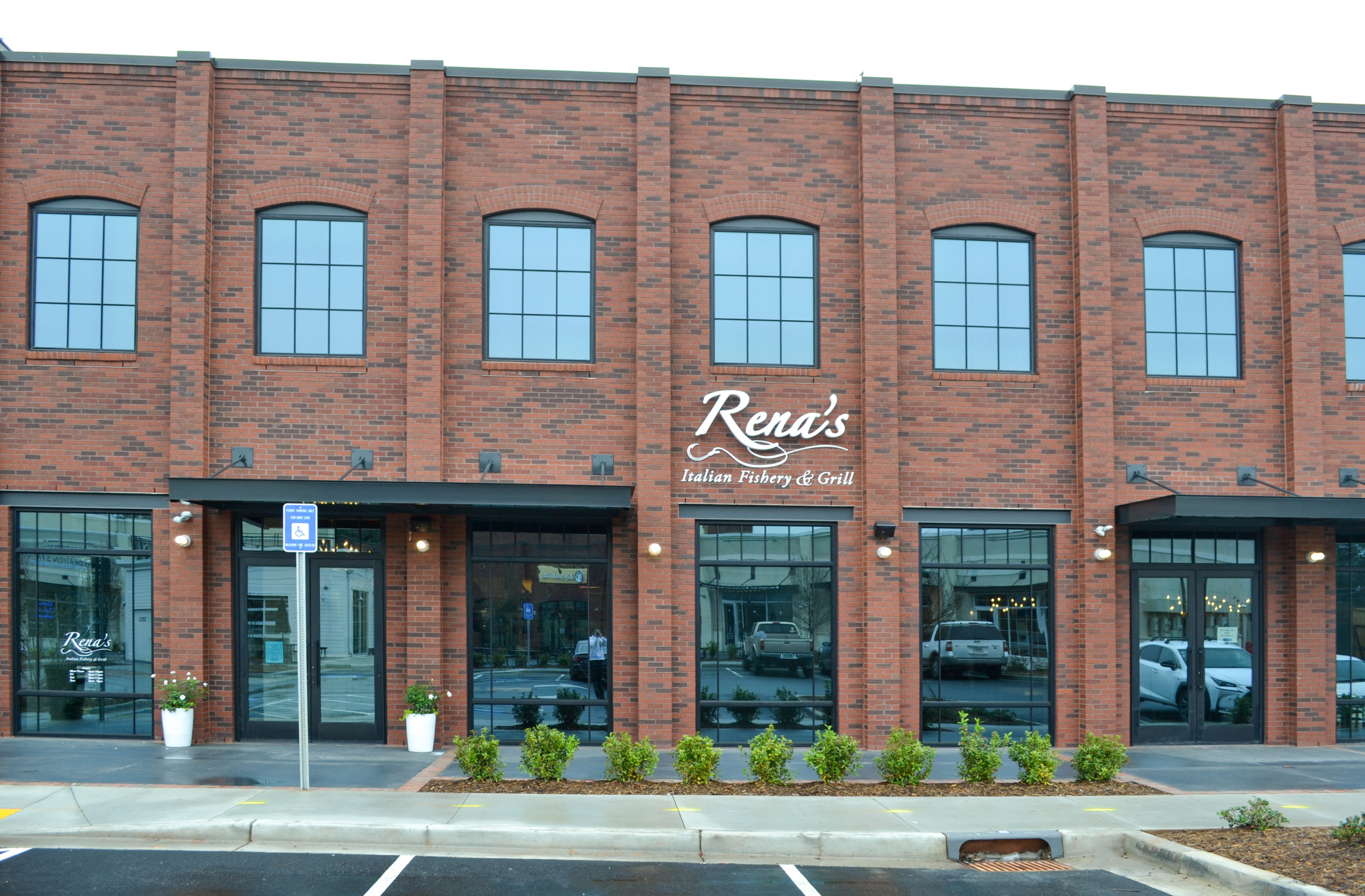 The brick storefront of Rena’s Italian Fishery & Grill.