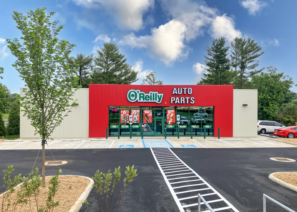 Exterior of an O’Reilly Auto Parts store with red signage and a parking lot.