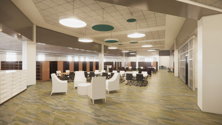A wide view of a modern library or office space with a lounge area featuring white armchairs, followed by several rows of tables and chairs.