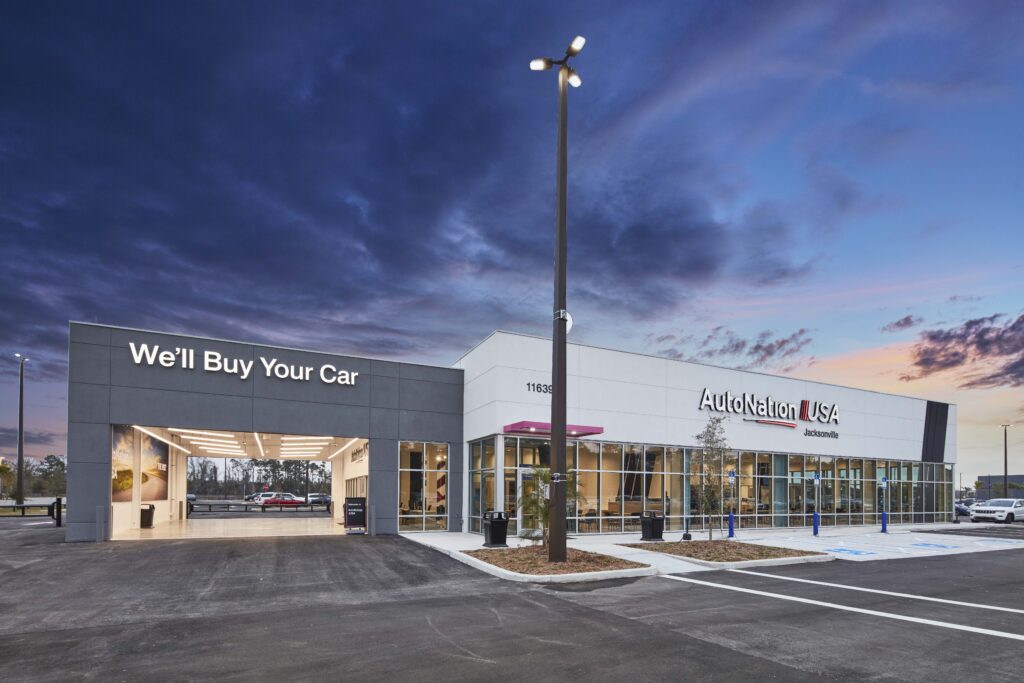 AutoNation USA dealership in Jacksonville at dusk.