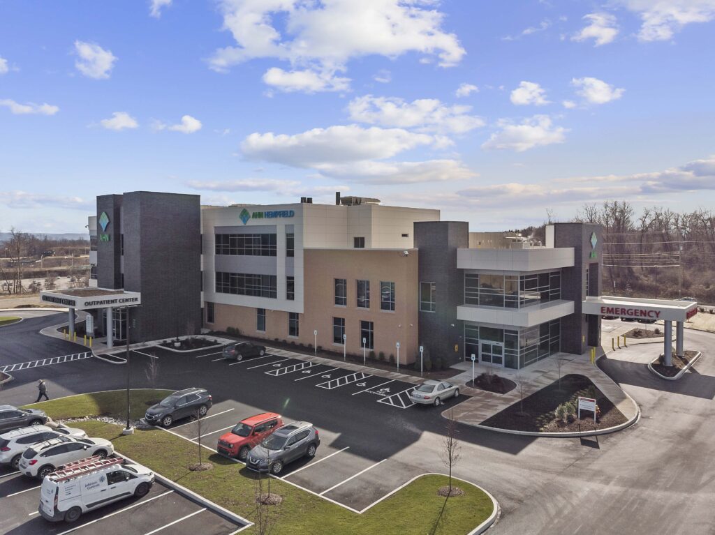 Aerial view of the AHN Hempfield outpatient center with an emergency entrance and parking lot.