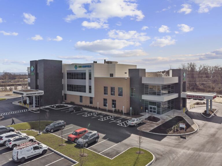 Aerial view of the AHN Hempfield outpatient center with an emergency entrance and parking lot.