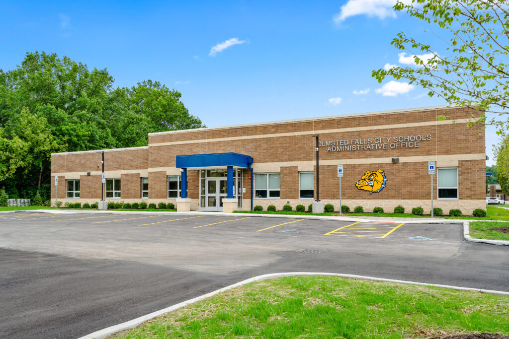 Olmsted Falls City Schools Administrative Office building with a paved parking lot in front.