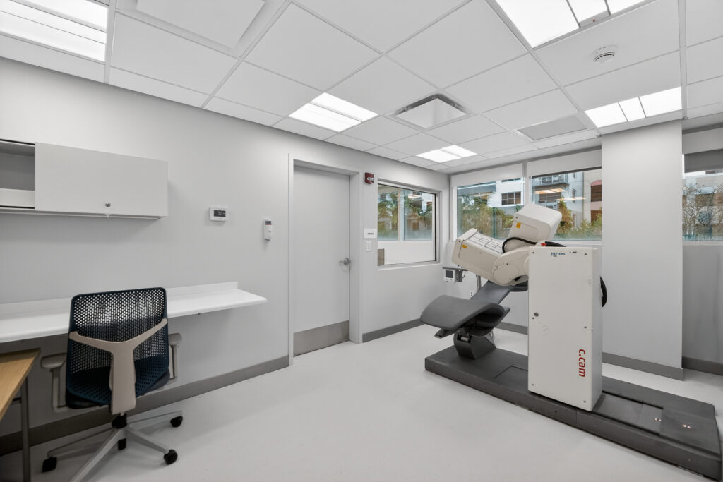 Medical exam room featuring a Siemens C.cam nuclear medicine scanner.