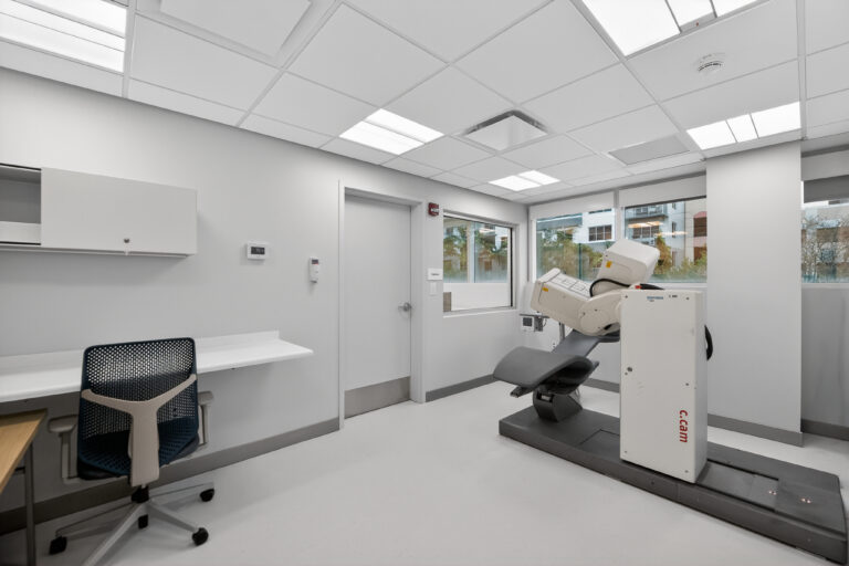 Medical exam room featuring a Siemens C.cam nuclear medicine scanner.