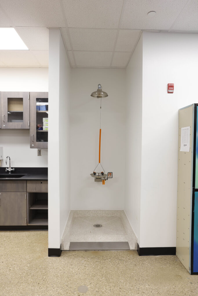 Emergency eye wash and shower station in a laboratory setting.
