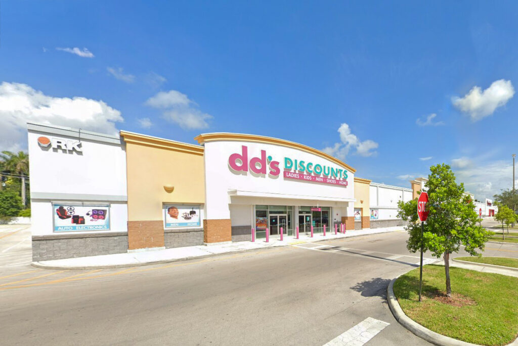 Exterior of a dd’s DISCOUNTS store in a strip mall.