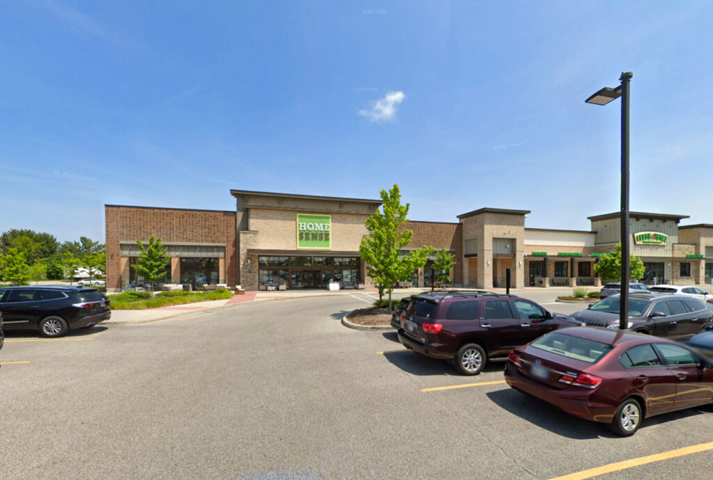 Exterior of a HomeSense store in a shopping center parking lot.