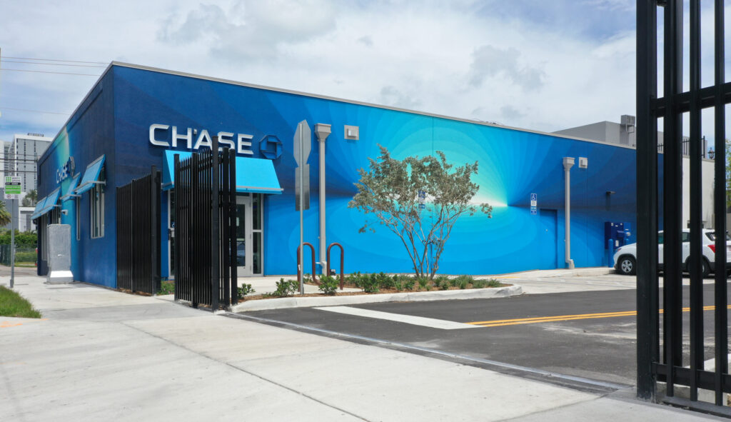 A Chase bank branch featuring a blue exterior wall with a spiral mural.