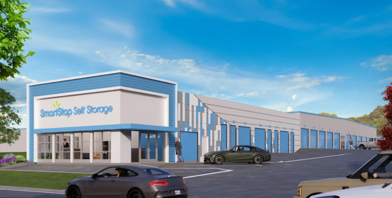 A rendering of a SmartStop Self Storage facility featuring a white and blue facade, roll-up storage doors, and parked cars.