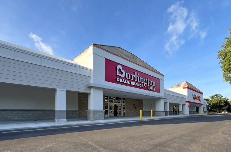 Exterior of a Burlington store with a red sign reading “Deals. Brands. Wow.”