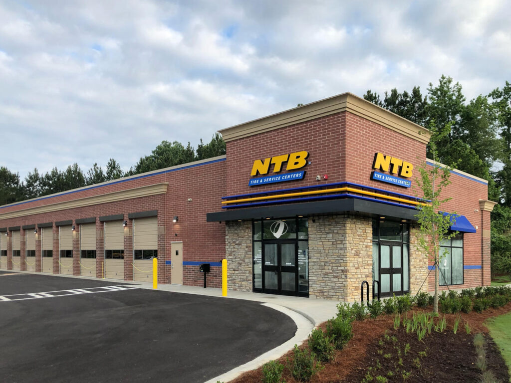 NTB Tire & Service Center building with a brick exterior and multiple garage bays.
