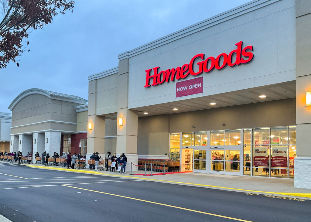 A long line of shoppers with carts waiting to enter a HomeGoods store on its opening day.