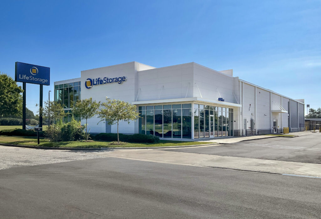 Life Storage building with a large street sign and a glass-fronted office entrance.