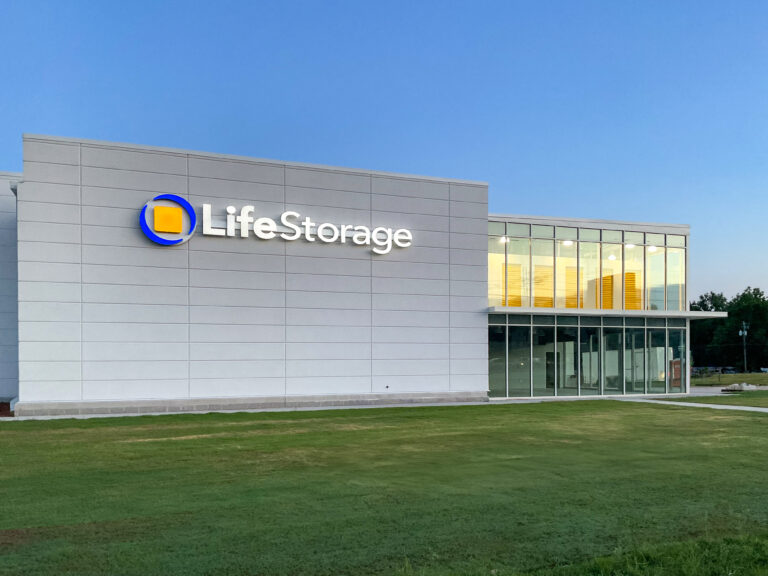 Life Storage building with a gray facade, blue and yellow logo, and glass storefront.