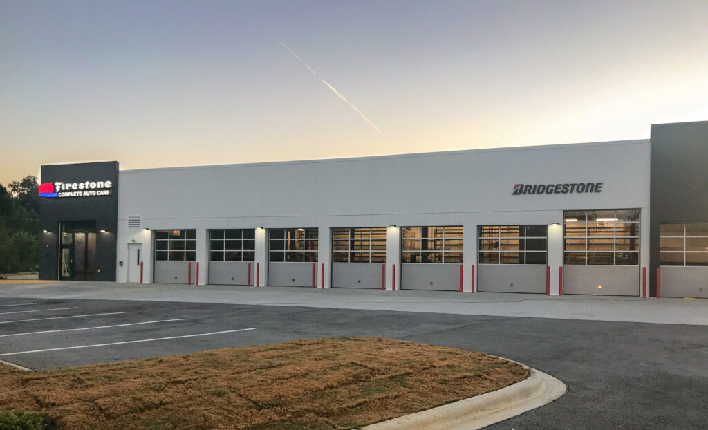 Firestone Complete Auto Care center with multiple service bay doors.