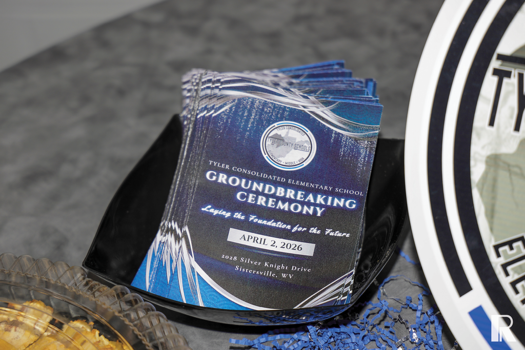 Stack of event programs for the Tyler Consolidated Elementary School Groundbreaking Ceremony on April 2, 2026.