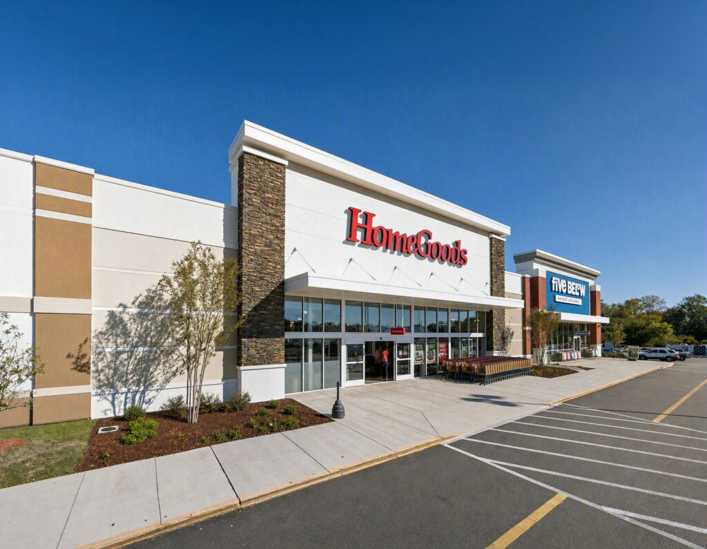 HomeGoods and Five Below storefronts in a strip mall shopping center with a parking lot in the foreground.