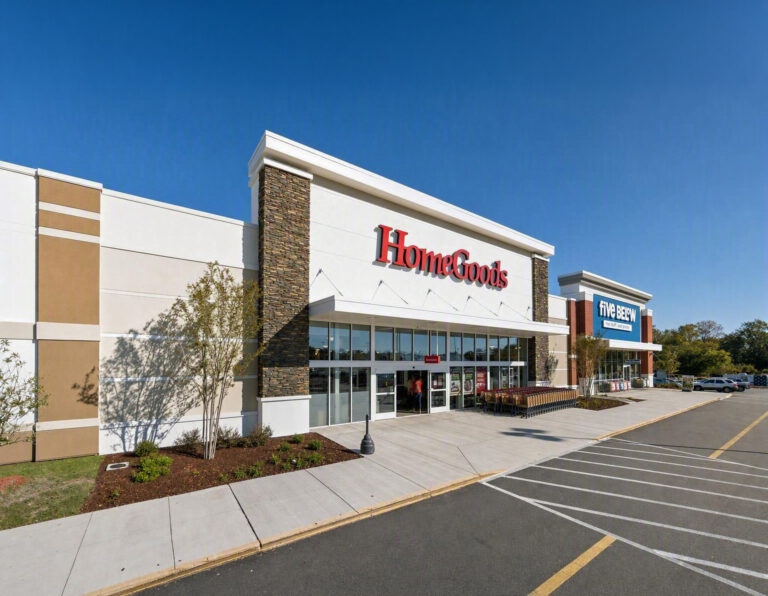 HomeGoods and Five Below storefronts in a strip mall shopping center with a parking lot in the foreground.