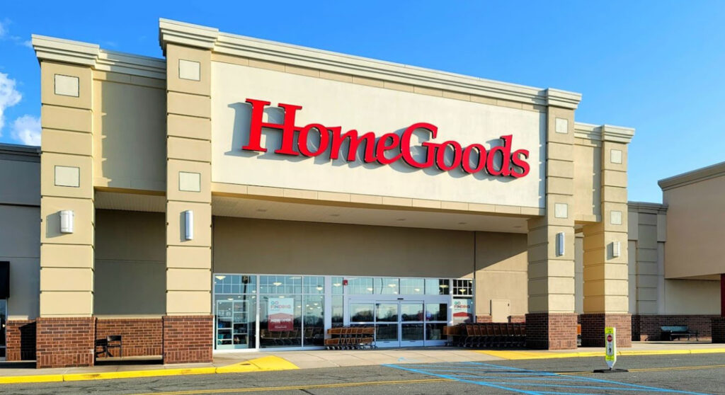 Exterior of a HomeGoods store with a red sign above the glass entrance doors.